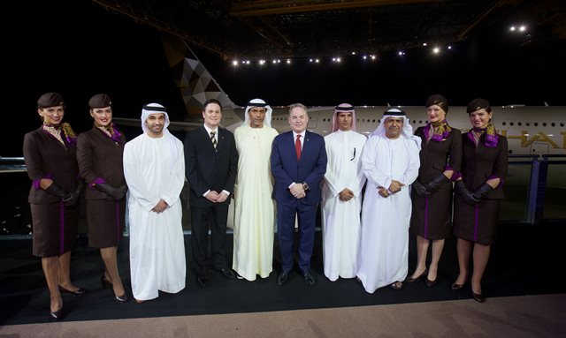 Etihad - A380 - (Left to right all Etihad Airways) Hareb Al Muhairy, VP UAE; Peter Baumgartner, Chief Commercial Officer; Abdul Qader Hussein Ahmed, VP Government and International Affairs; James Hogan, President and Chief Executive Officer; Khaled Al Mehairbi, SVP Government and Aeropolitical Affairs; Hasan Al Hammadi, SVP Executive Affairs; with members of the airline’s cabin crew, in front of Etihad Airways’ first A380.