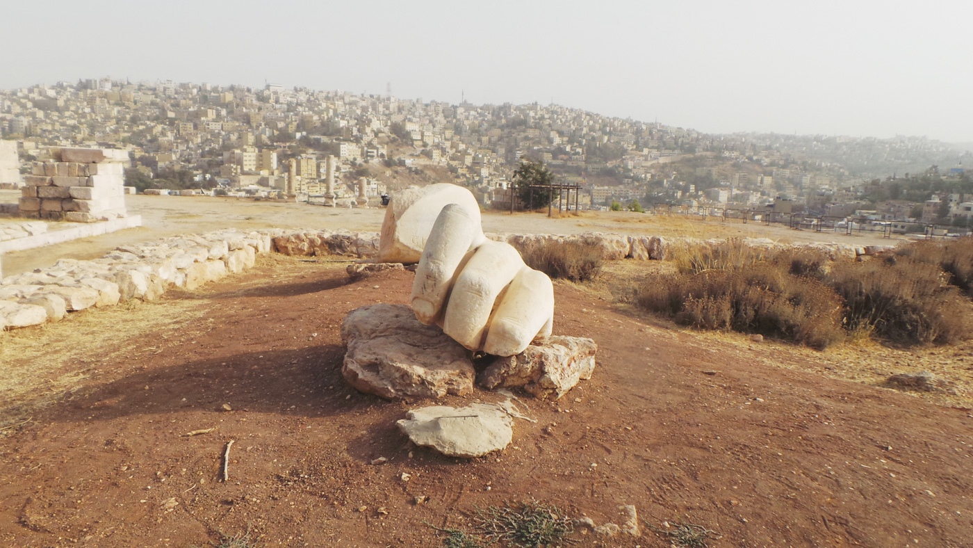 An ancient sculpture known as the Hand of Hercules that be witnessed at Amman Citadel