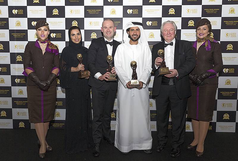 Mohammad Al Bulooki, Vice President, UAE & GCC Commercial; Amina Taher, Head of Communications and Calum Laming, Vice President Guest Experience, representing Etihad Airways at last night's World Travel Awards Middle East in Dubai. Pictured with Graham Cooke, President and Founder, World Travel Awards.
