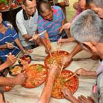 Prosperous toss: Elderly tossed yee sang with resort staff to ring in good fortune and auspicious year of the Horse.
