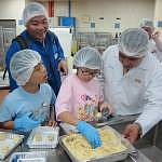 BAC staff guiding kids on cookie-making