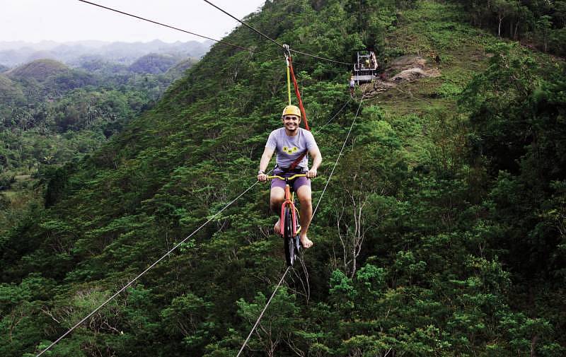 One of the activities at Chocolate Hills Adventure Park - Bicycle Zip Lining.
