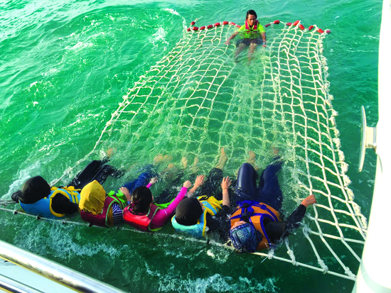 Dip and swim at the middle of the ocean while waiting for the sun to go dow