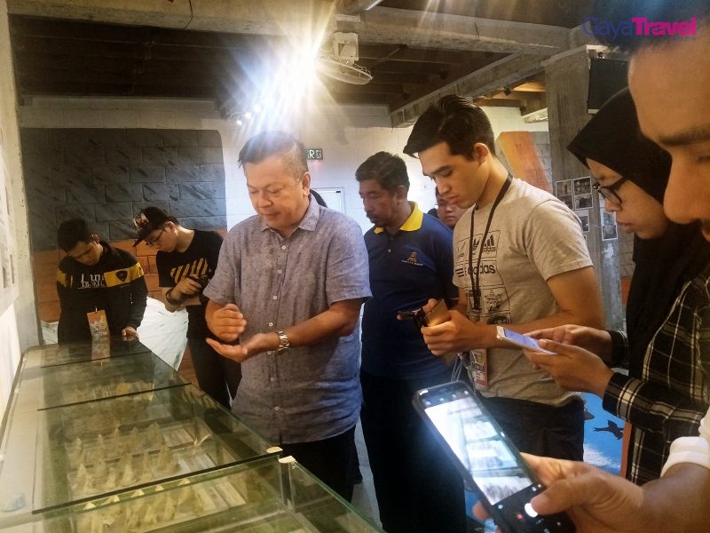 Visitors getting in-depth knowledge about bird nest processing at the museum.