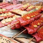 Well marbled wagyu beef with ikura topping on skewer;