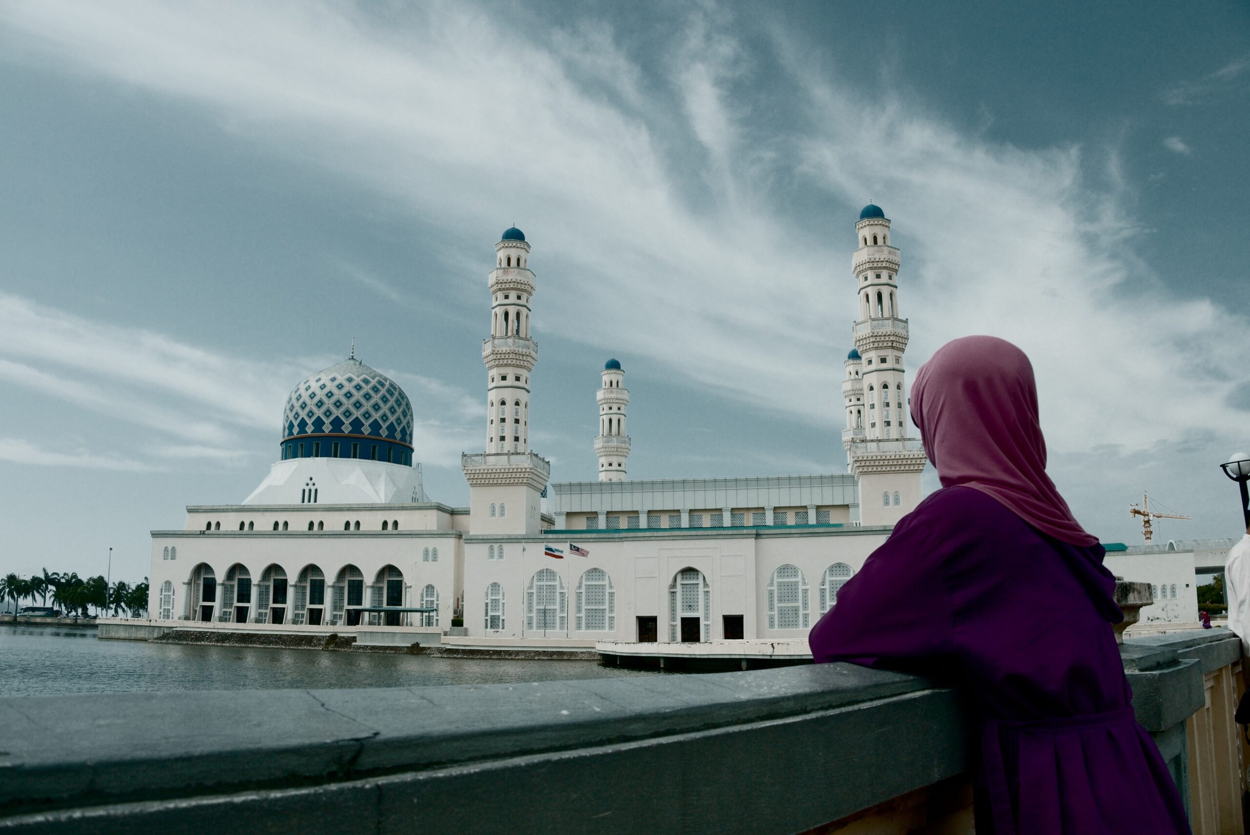 woman looking at mosque