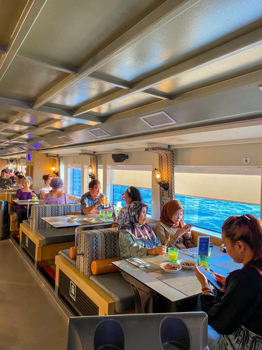 Enjoying the scrumptious buffet on board North Borneo Cruise while admiring the change of scenery throughout the journey.
