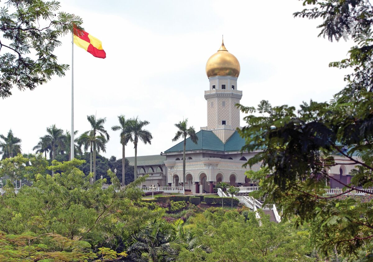 Islamic golden domed palace architecture of the imposing Istana Alam Shah, or Selangor Royal Palace, royal palace of the Sultan of Selangor, with the Royal flag, seen from the street outside of the manicured gardens, Klang, Malaysia. © Tourism Selangor