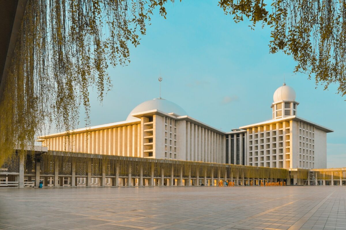 a large white building with two white domes on top of it