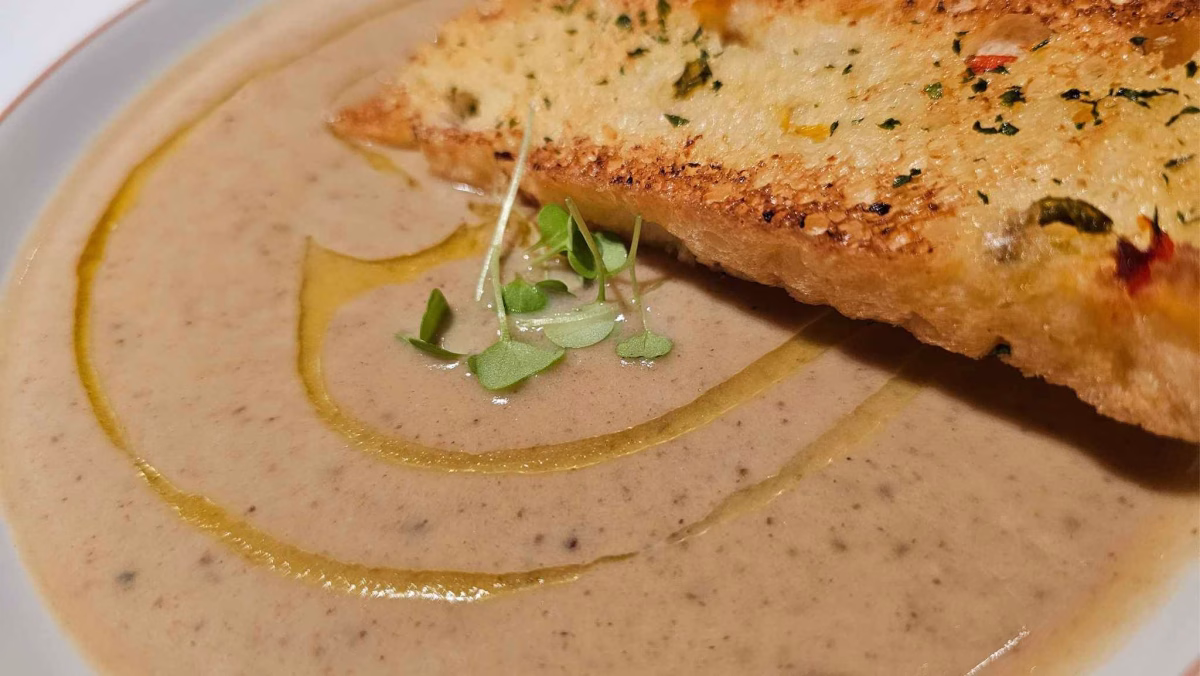 Creamy veloute soup of chestnuts, olive oil, and garlic focaccia served at Favola. Photo by Juhan bin Kamaruddin.