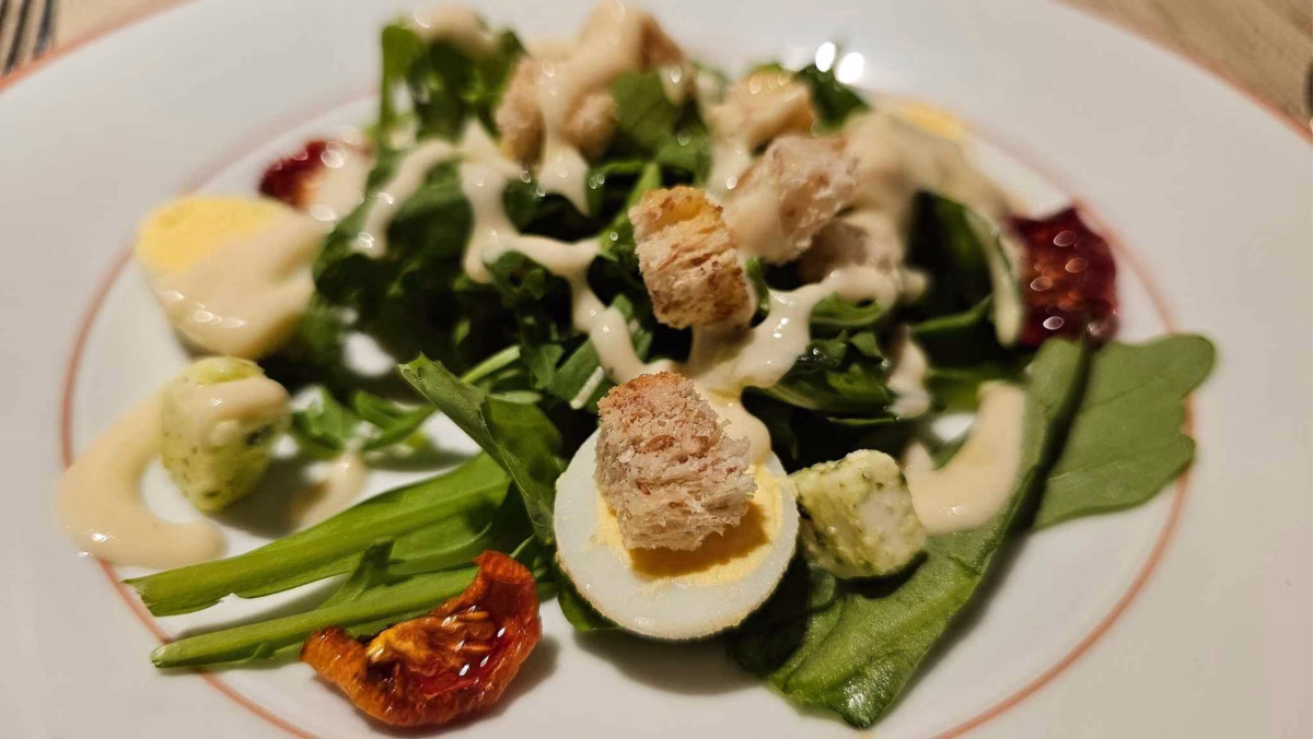 Organic rocket salad with feta cheese, quail eggs, tomatoes, and croutons served at Favola. Photo by Juhan bin Kamaruddin.