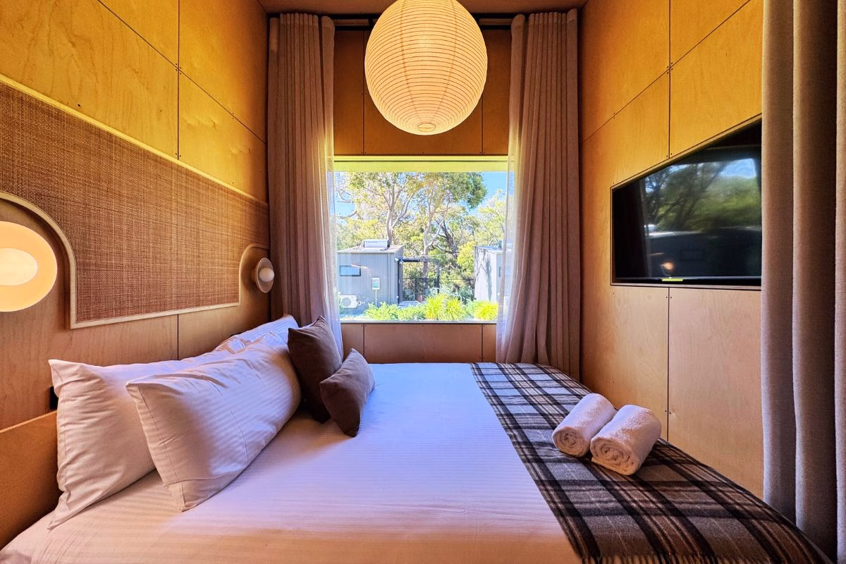 Waking up to a view of the trees from a bed this comfortable is the definition of a "really upgraded" camp.