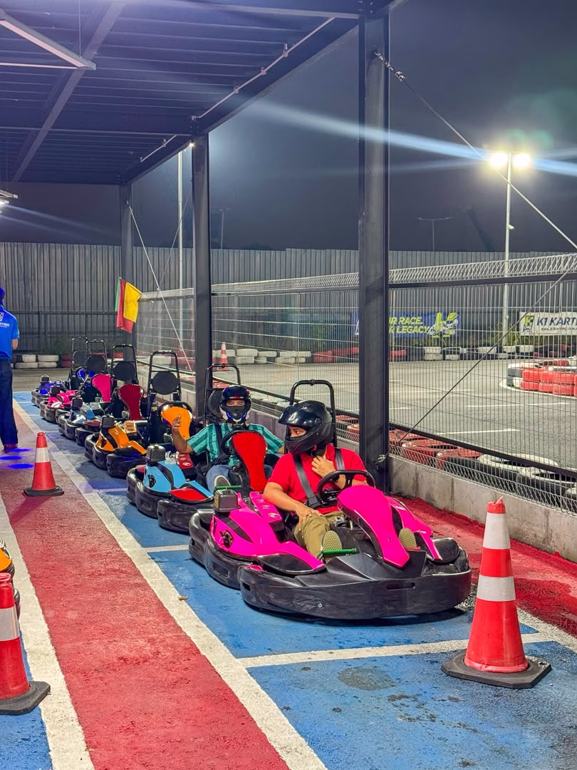 Visitors preparing to race go-karts at K1 Karting Setia Alam in Shah Alam