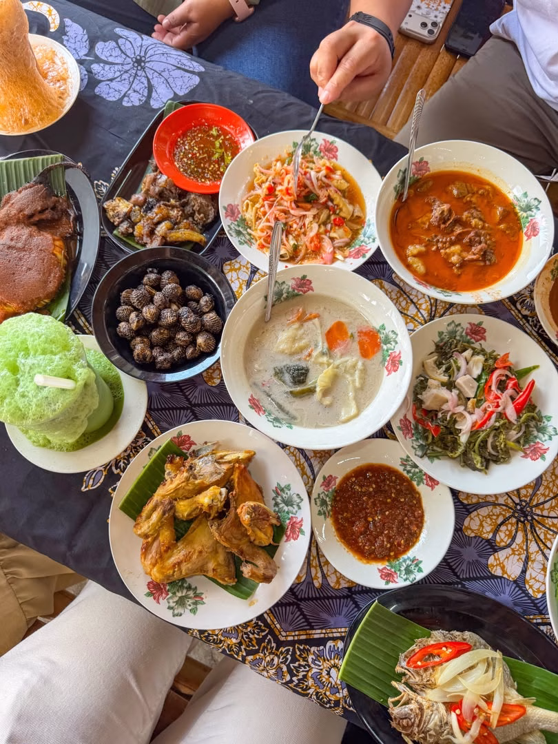 Traditional Malay dishes including grilled fish, nasi ulam and sambal at Nasi Ulam Ikan Bakar Jalan Kebun, Shah Alam