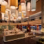 Pullman Kuching's renewed lobby brings together layered textures, woven motifs and warm lighting in a spacious social setting inspired by Sarawak's natural landscape.