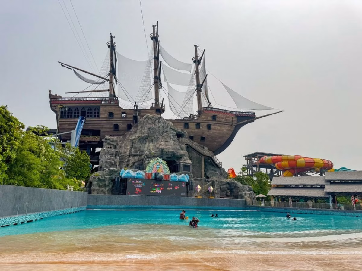 A large pirate ship-themed water attraction and colourful slides at SplashMania Waterpark in Gamuda Cove, Selangor, Malaysia.