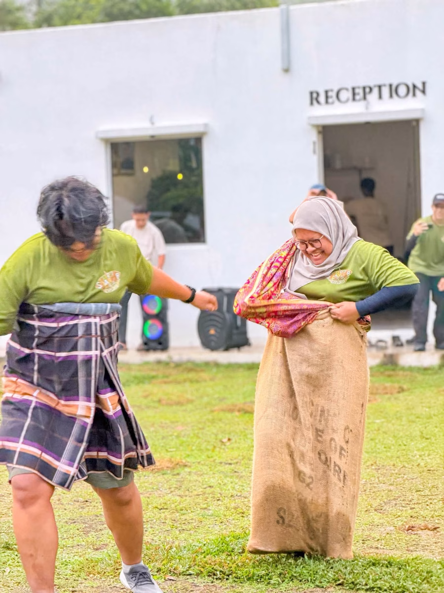 Having fun with the traditional sack race!